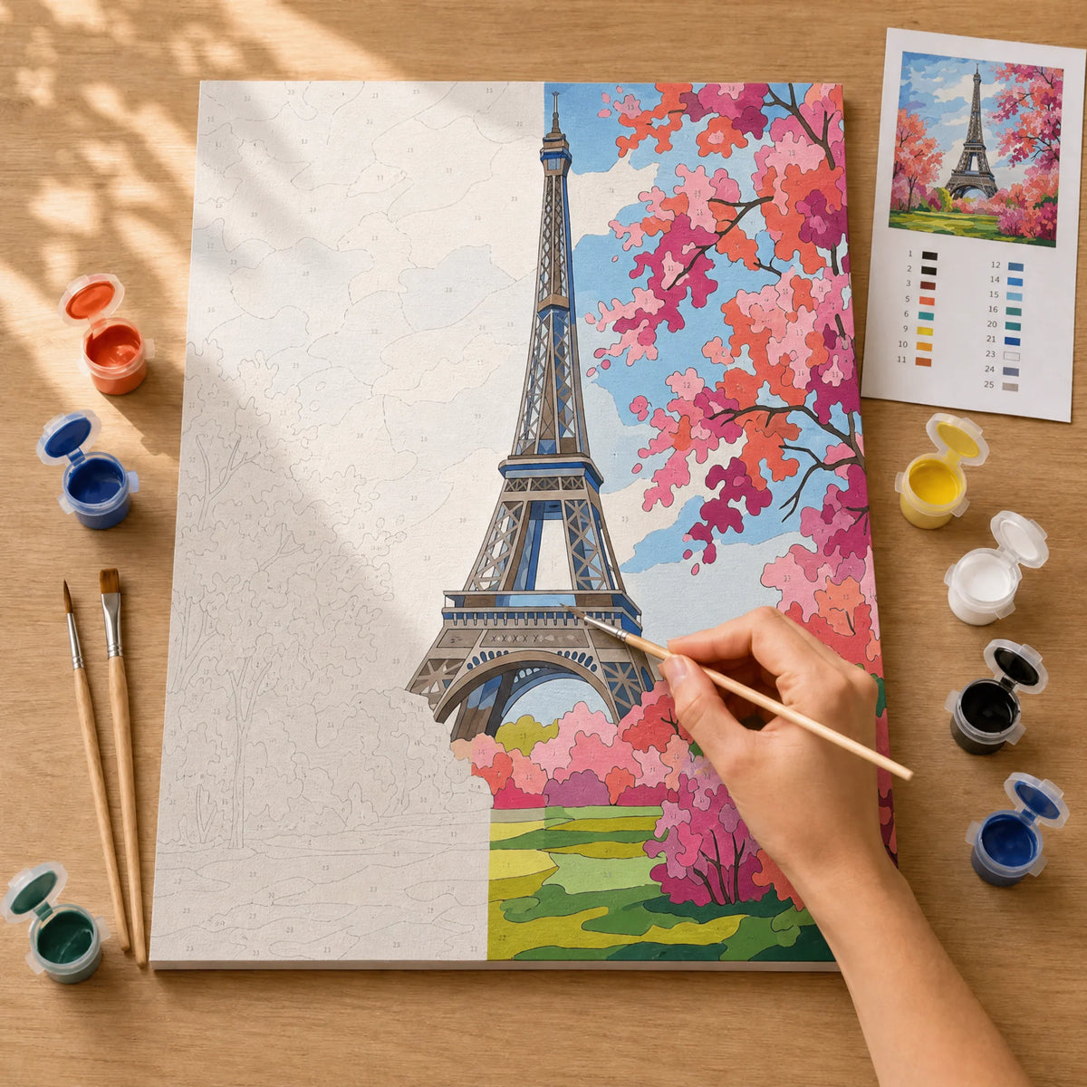Eiffel Tower in Bloom Paint by Numbers Kit: before and after: numbered canvas and hand painted result