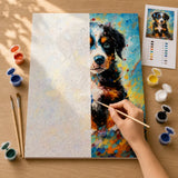 Before and after: half numbered canvas, half painted Bernese puppy artwork with hand painting