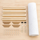 stretcher bars, corner inserts, pins and rolled canvas flat lay | DIY Wooden Canvas Stretcher Frame