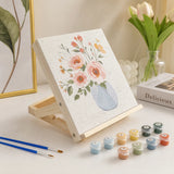 easel holding a paint by numbers canvas with paints and brushes | Foldable Wooden Tabletop Easel